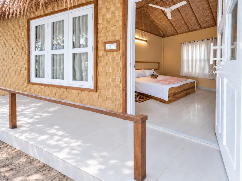 Veranda and open doorway showing the bedroom of an Exclusive Couple Villa at Dwipantor